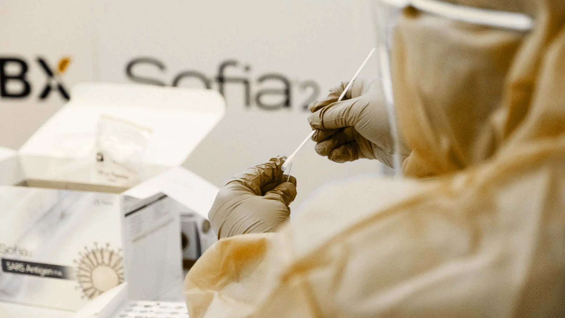 person with medical gloves swopping a sample